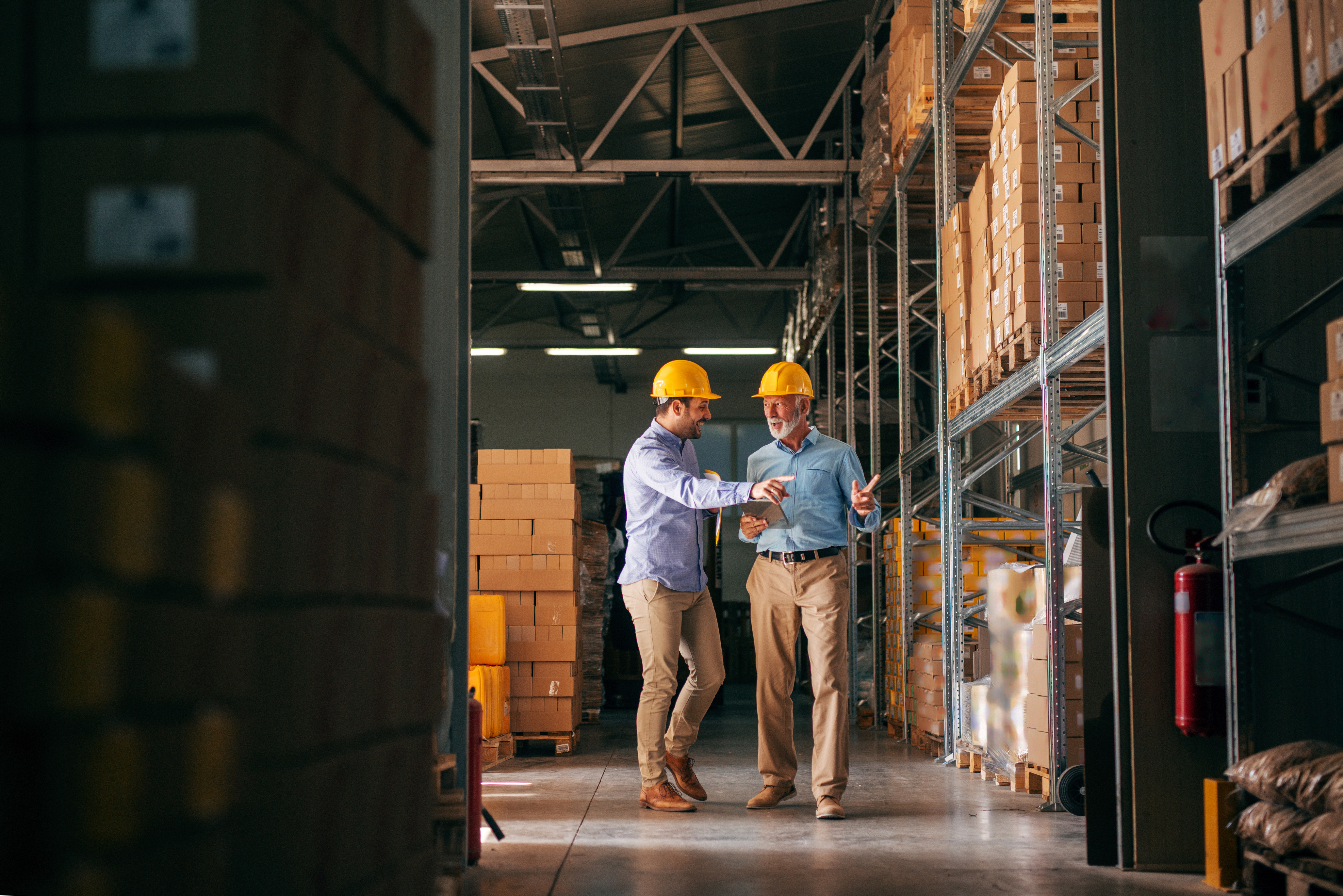 Two people viewing technology in relation to workplace safety.