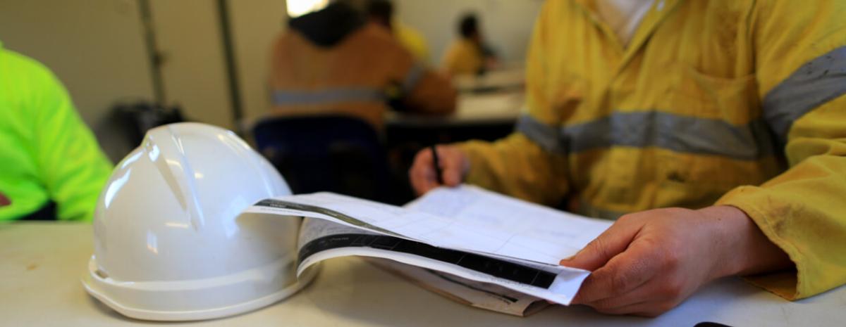 Miner reviewing  assessment, msha training at construction mine site